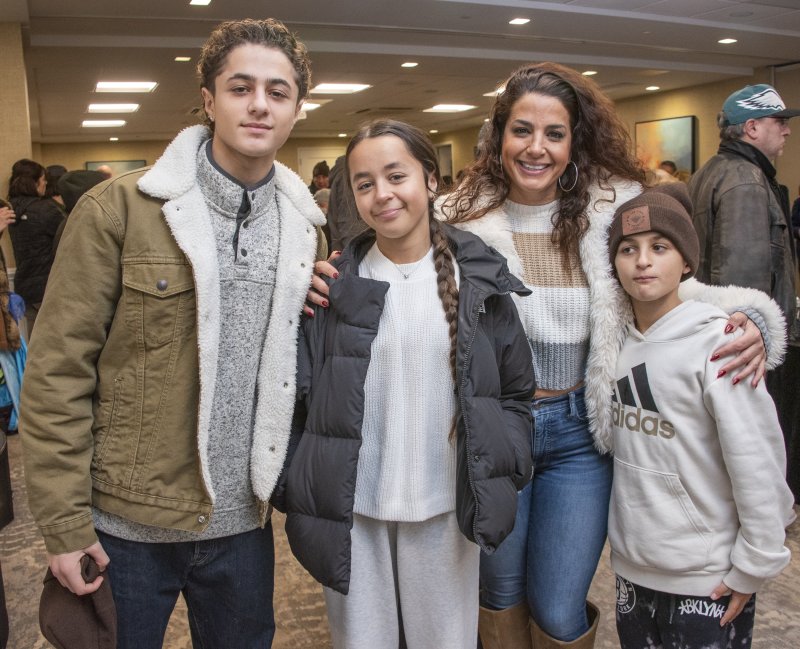 Members of the Stegall family of Milton gathered before the menorah lighting are (l-r) Liam, Morin, Talioa and Aidan Stegall.